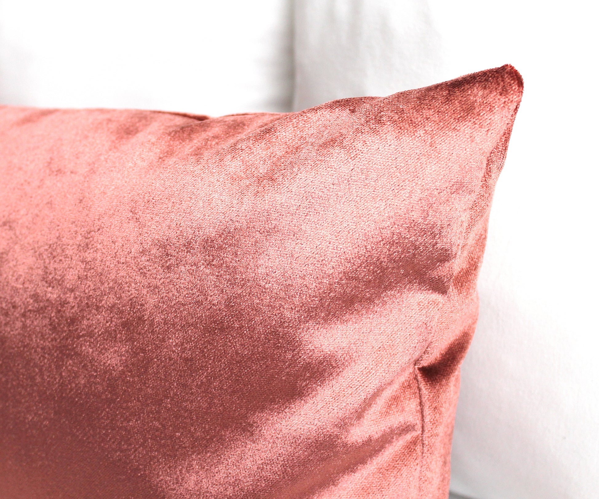 Premium velvet pillow covers in coral. Introduce luxe texture into your space with the Coral Premium Velvet Throw Pillow Cover. Made from luxuriously soft, salmon-colored velvet, this pillow cover adds a cozy, inviting feel to any setting. It's the perfect accessory to make your space stand out.