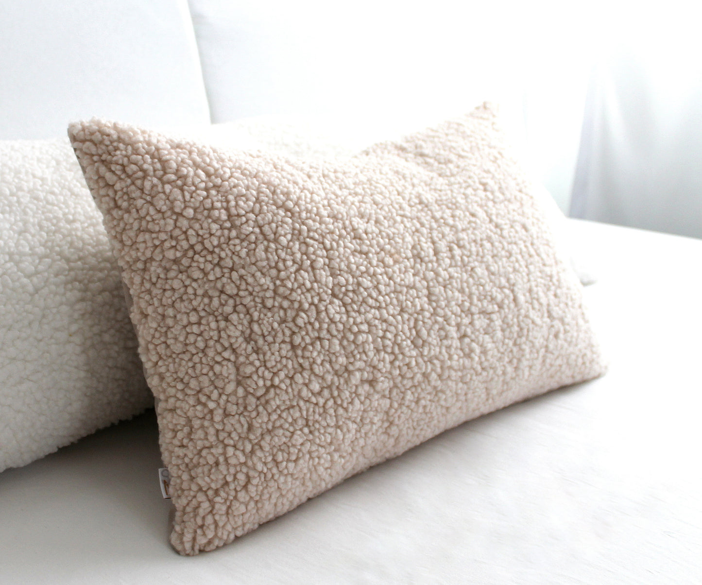 Create a cozy look to your space with this Cream Cozy Teddy Boucle Throw Pillow Cover. The classic texture adds a warm and inviting touch to your sofa or bed. Comfortable to touch makes it perfect for snuggling up with!