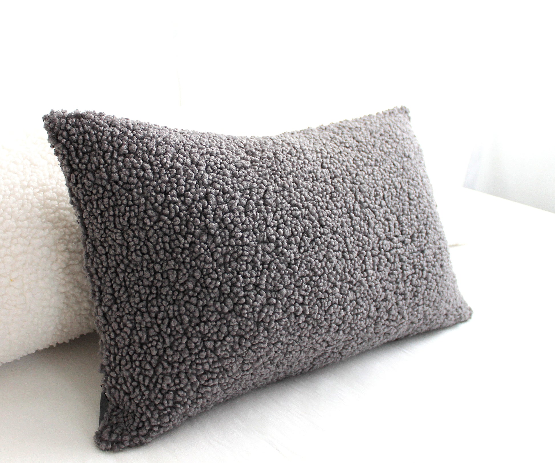 Create a cozy look to your space with this Dark Grey Cozy Teddy Boucle Throw Pillow Cover. The classic texture adds a warm and inviting touch to your sofa or bed. Comfortable to touch makes it perfect for snuggling up with!