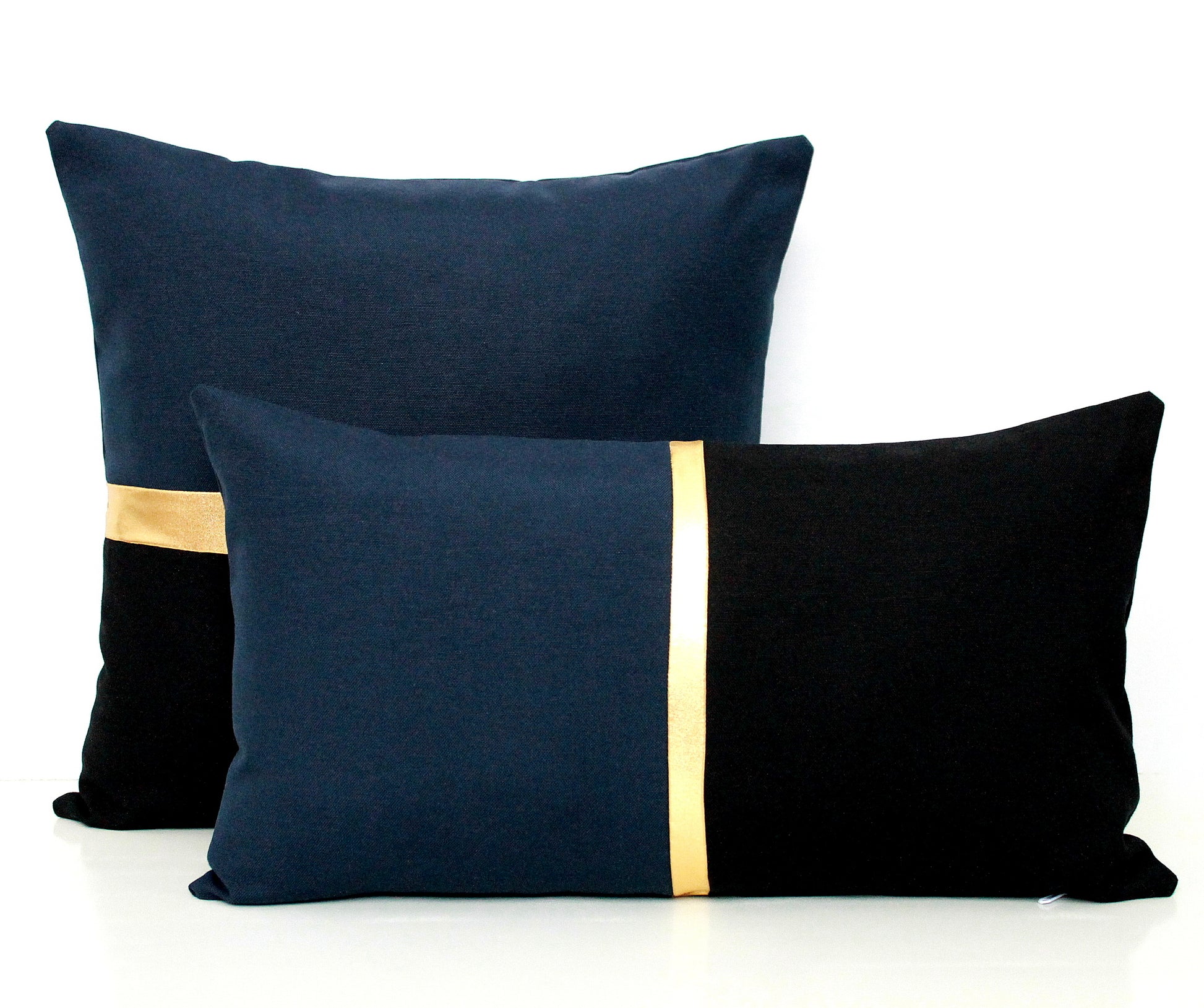 These affordable pillow covers are a must if you are looking for a touch of elegance in your home. The navy blue and black cotton is made to pop with a custom stripe of silver, gold or copper.