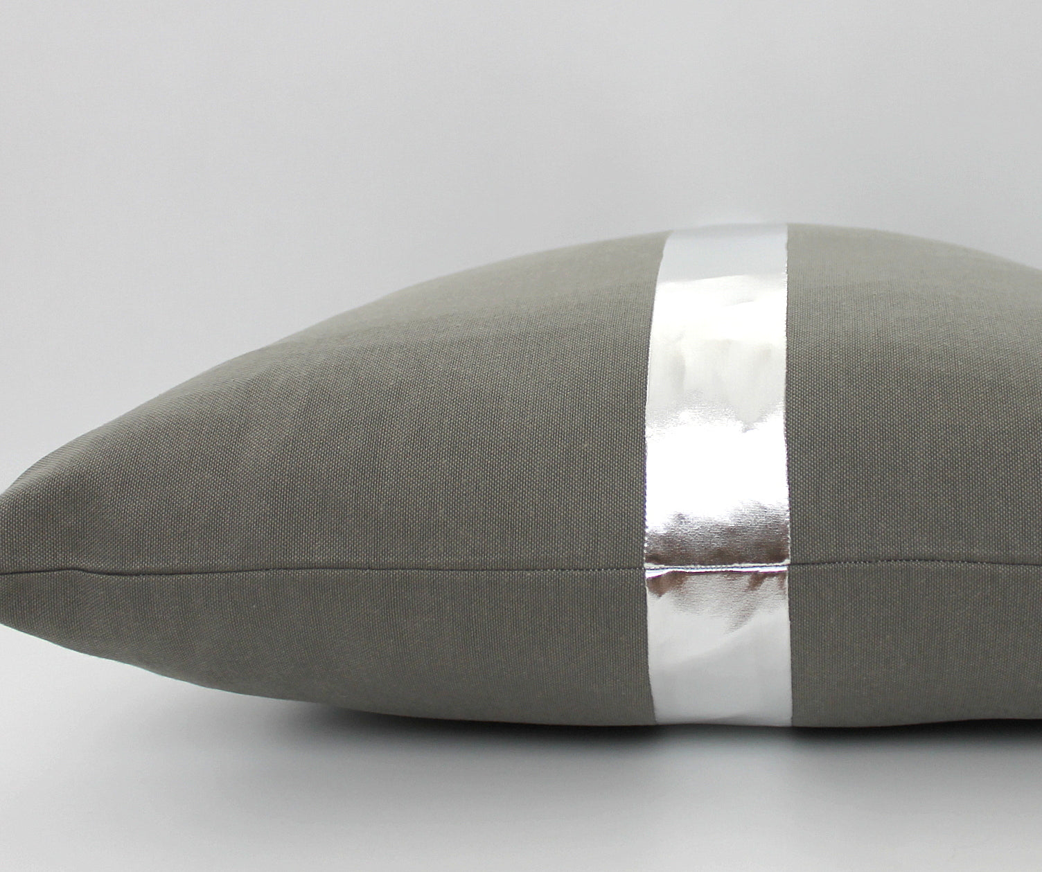 These affordable pillow covers are a must if you are looking for a touch of elegance in your home. The dark grey cotton is made to pop with a custom stripe of silver, gold or copper.