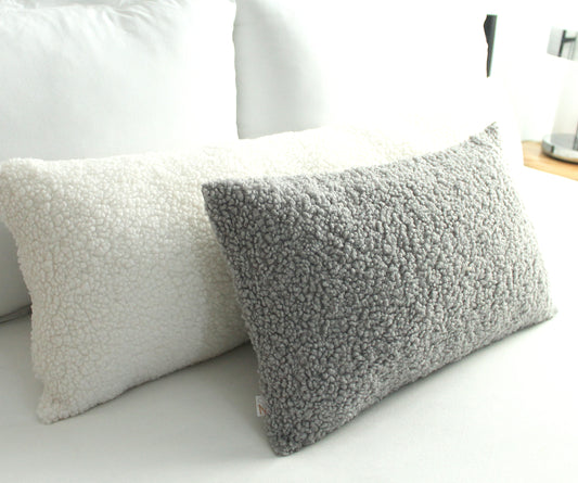 Create a cozy look to your space with this Light Grey Cozy Teddy Boucle Throw Pillow Cover. The classic texture adds a warm and inviting touch to your sofa or bed. Comfortable to touch makes it perfect for snuggling up with!